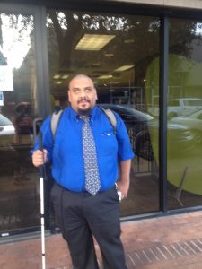 Photo of Gabe Vega standing in front of his office in Arizona